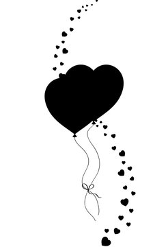 Black silhouette of couple heart shaped helium balloons
