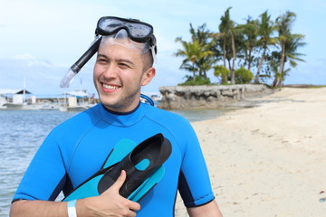 Cheerful ethnic male about to dive in the Ocean 