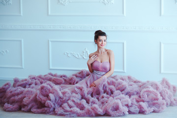 Beauty brunette model woman in evening purple dress. Beautiful fashion luxury makeup and hairstyle....