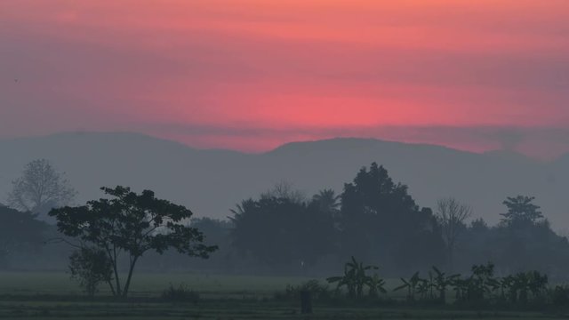 Time lapse Sunrise over country landscape in Chiang Mai, Thailand.