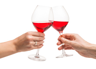 Couple drinking wine, hands with toasting glasses close-up