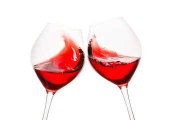 Toasting glasses with red wine
