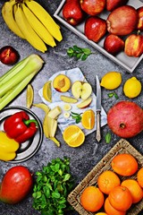 Fresh fruits and vegetables on the dark background. Top view fruits and vegetables. Shopping basket. Shopping list