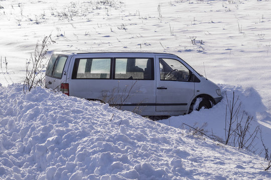 Car In Ditch After Winter Accident. Vehicle Loses Control And Drove Off Road At Ice.