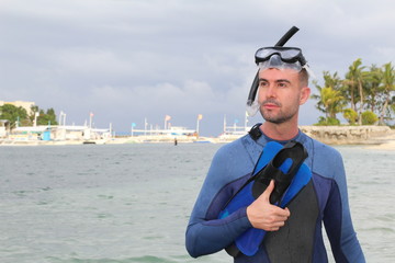 Gorgeous man wearing wet suit