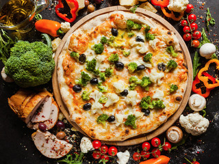 Vegan cauliflower broccoli pizza. Diet dish with lots of vegetable proteins for healthy nutrition concept