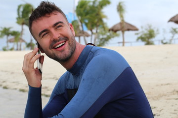 Gorgeous surfer calling by phone