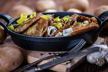 traditional hanukkah fried potato pancakes in black iron cast pan 