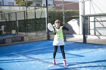 Fototapeta na wymiar One women 47 years old playing Paddle tennis