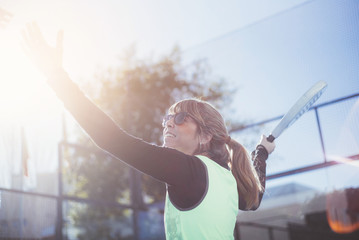 One women 47 years old playing Paddle tennis