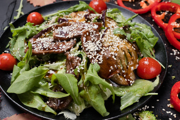 baked meat with fresh vegetables salad. healthy food. proper and delicious nutrition.