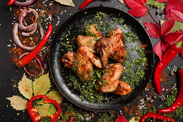 ready made fried chicken wings dish. fatty and unhealthy food. meat fans.