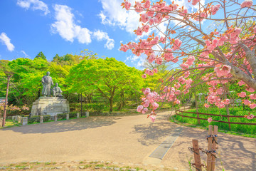 Statue of Sakamoto Ryoma and Nakaoka Shintaro at Maruyama Park, spring season with cherry blossom in Kyoto, Japan. Maruyama Park is Kyoto's most famous cherry-blossom viewing hanami spot. © bennymarty