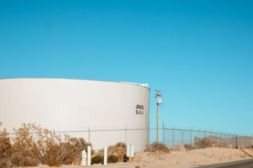 Water tank against the blue sky in the desert