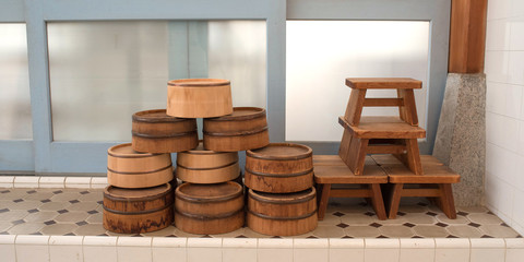 Fototapeta premium Buckets and stools in Japanese public bathhouse (Sento) 銭湯の風呂桶と椅子