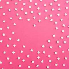 Marshmallows on pink background. Heart. Flat lay. Top view