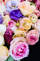 beautiful flowers assortment on dark background. floristic art