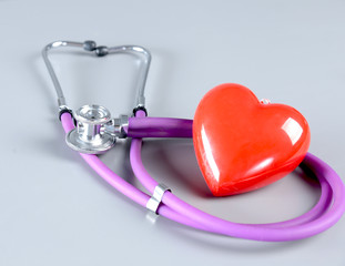 stethoscope and Red heart on white background. Selective focus.