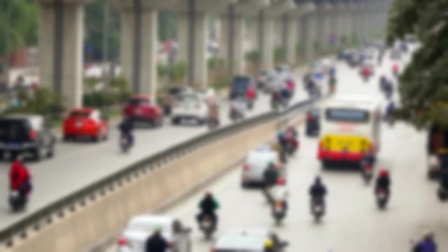 Road Traffic in Vietnam. Vague picture. The brisk road in the center of the Vietnamese city. Concrete jungle.