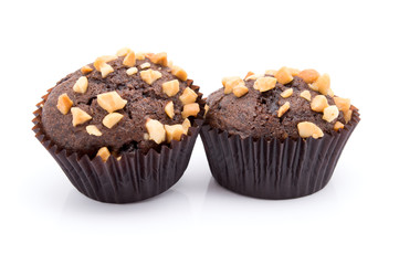 Group of chocolate muffins with nuts crumbs isolated on white background