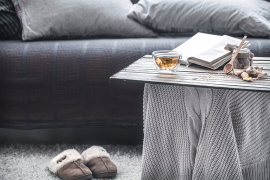 slippers in the living room by the couch - Powered by Adobe