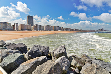 View from the sandy beach on the city. Summer day in Ostende, Belgium