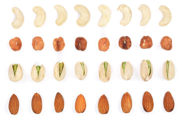 Mix nuts almonds, cashews hazelnuts pistachios isolated on white background. Top view. Flat lay