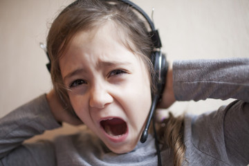 Little girl with headphones