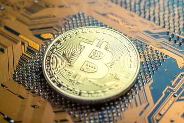 Coin Bitcoin on the electronic Board. Mining cryptocurrency. Concept of technologies blockchain of virtual currencies