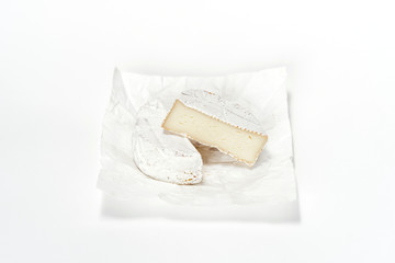 Cheese camembert on white paper. Menu design restaurant. Horizontal view. Cheese isolated.