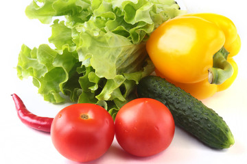 Assorted vegetables, fresh bell pepper, tomato, chilli pepper, cucumber and lettuce isolated on white background. Selective focus.