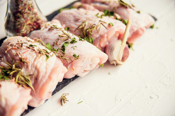 Raw chicken with spices, cooking background, top view