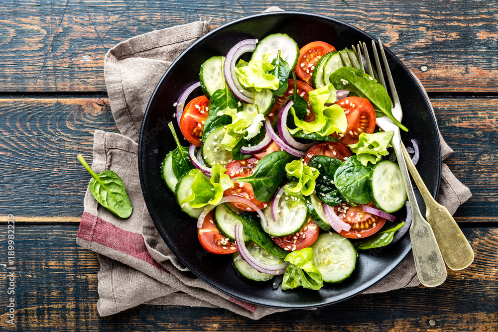 Canvas Prints healthy vegetable salad of fresh tomato, cucumber, spinach, onion and lettuce on plate. diet menu. t