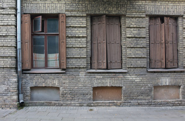 Fototapeta na wymiar Old European classic building three windows facade