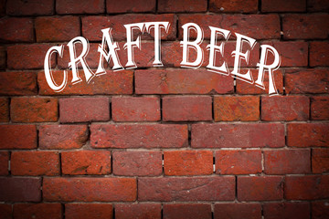 Fototapeta na wymiar 3d illustration of a red brick wall with a white inscription kraft beer.