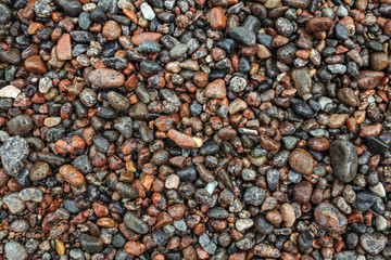 Wet colored sea stones texture