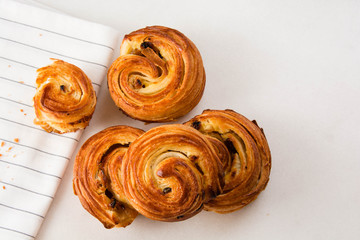 French traditional pastries. Croissant. Pains aux raisins.