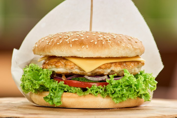 Classic sandwich, high quality, close up. Sandwich with vegetables, meat patty and cheese.