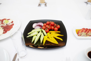 vegetables on a black plate