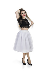 Girl in white skirt posing.