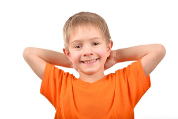 Emotional portrait of a teenager. A boy in an orange t-shirt. Beautiful and happy child isolated on a white background.