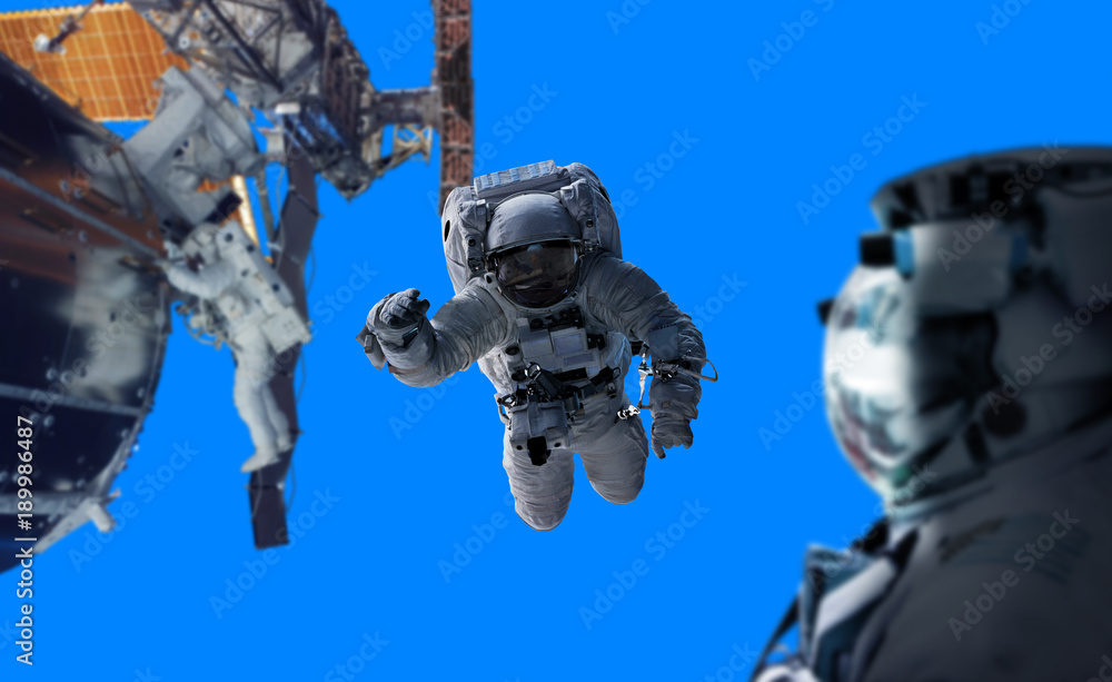 Poster astronaut working on a space station 3d rendering elements of this image furnished by nasa