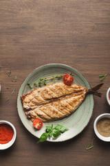 White fish juicy fillet grilled on barbecue