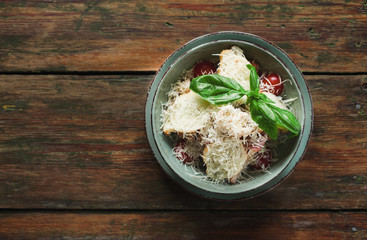 Salad with radish, toasts and parmesan cheese