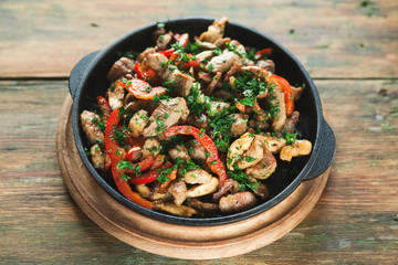 Roasted meat and vegetable on wooden table