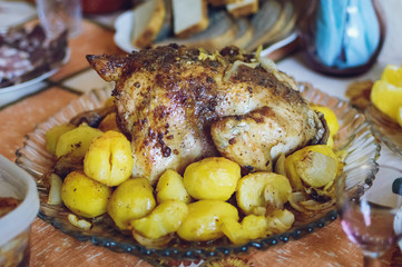 Baked chicken with potatoes, homemade food.