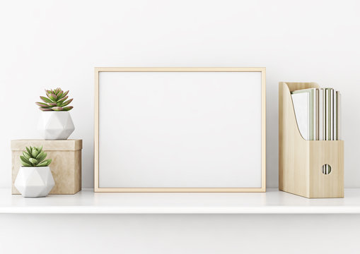 Home interior poster mock up with horizontal gold metal frame and succulents on white wall background. 3D rendering.