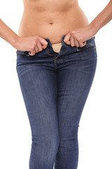 Excess weight. You can not zip up your jeans.