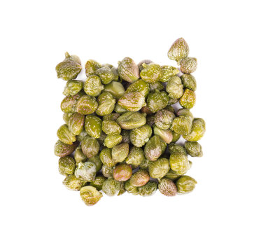 Capers isolated on white background. Pickled capers. Canned capers. Top view
