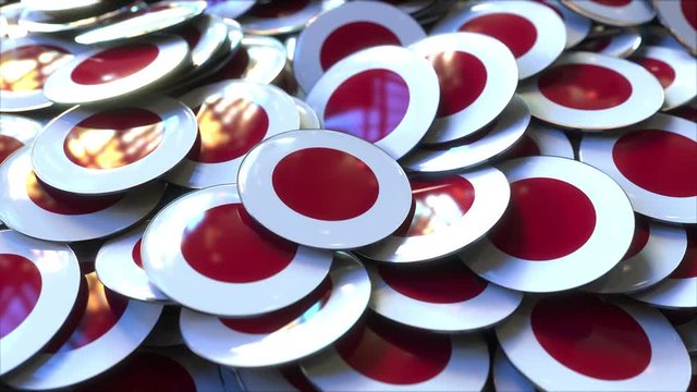Pile of badges featuring flags of Japan